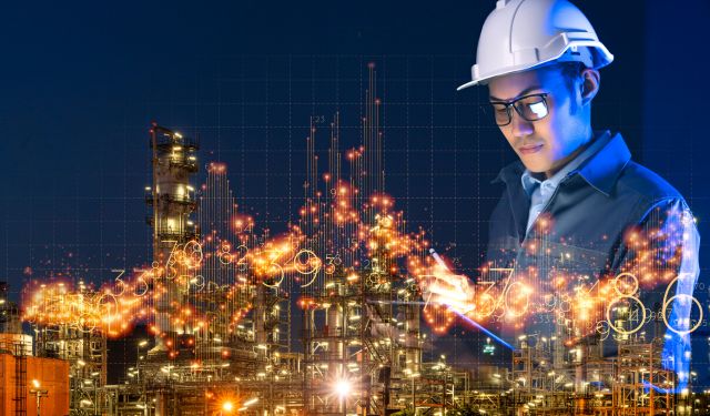 engineer and the oil and gas plant panorama at night