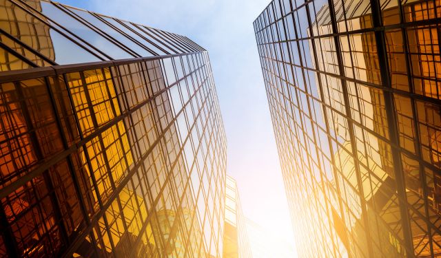 two yellow glass comercial tower blocks